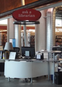 An "ask a librarian" sign hanging over a reference desk at the Squirrel Hill branch library