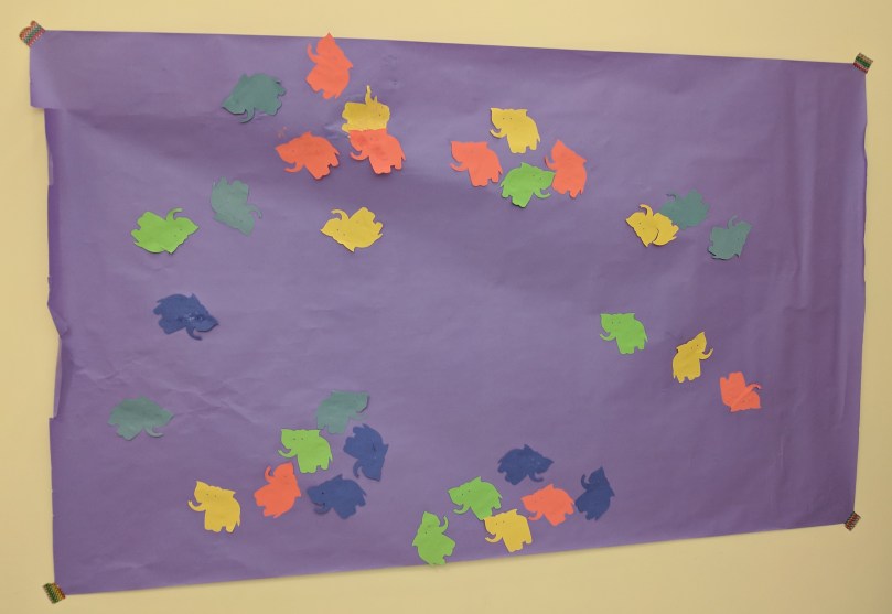 Purple paper with multicolored elephants