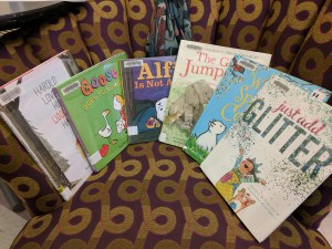 Books arranged on the reading chair