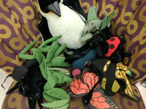 Bug puppets on chair