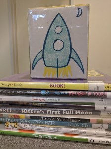 Song cube and stack of picture books