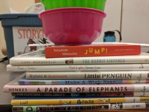 bowls of crayons, stack of books