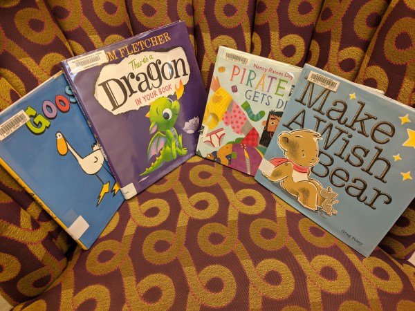 Goose, Dragon, Pirate, Bear books on chair