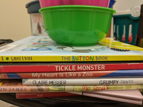 Storytime books with bowls of crayons