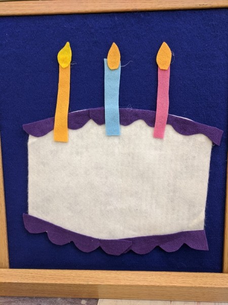 felt birthday cake and three candles