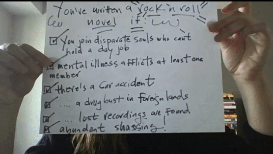 Screenshot of zoom event with David Mitchell; Heather holding up a checklist