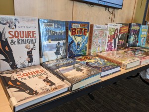 Book tasting table with two copies of each book