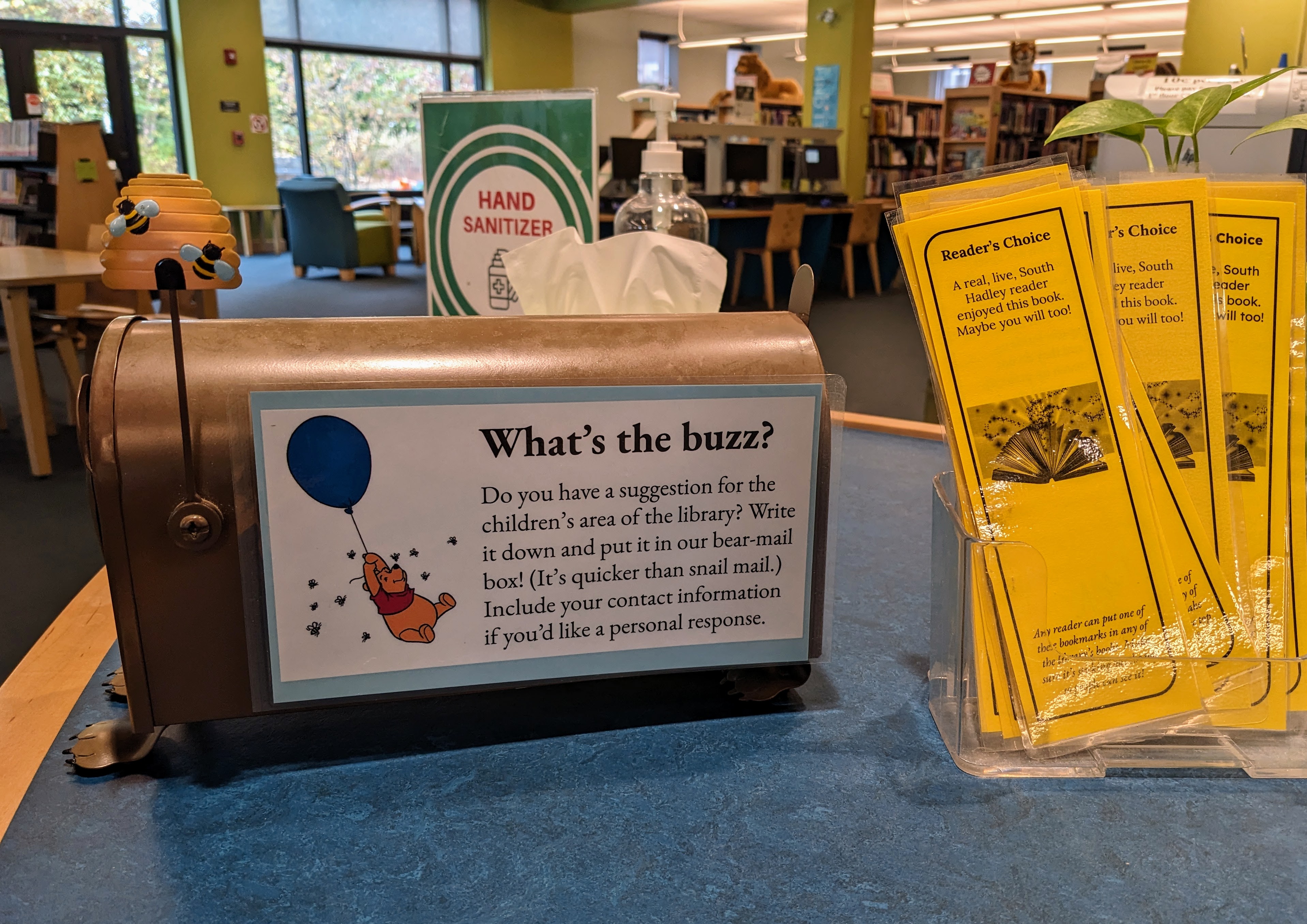 Side view of bear mailbox, with "what's the buzz?" instructions