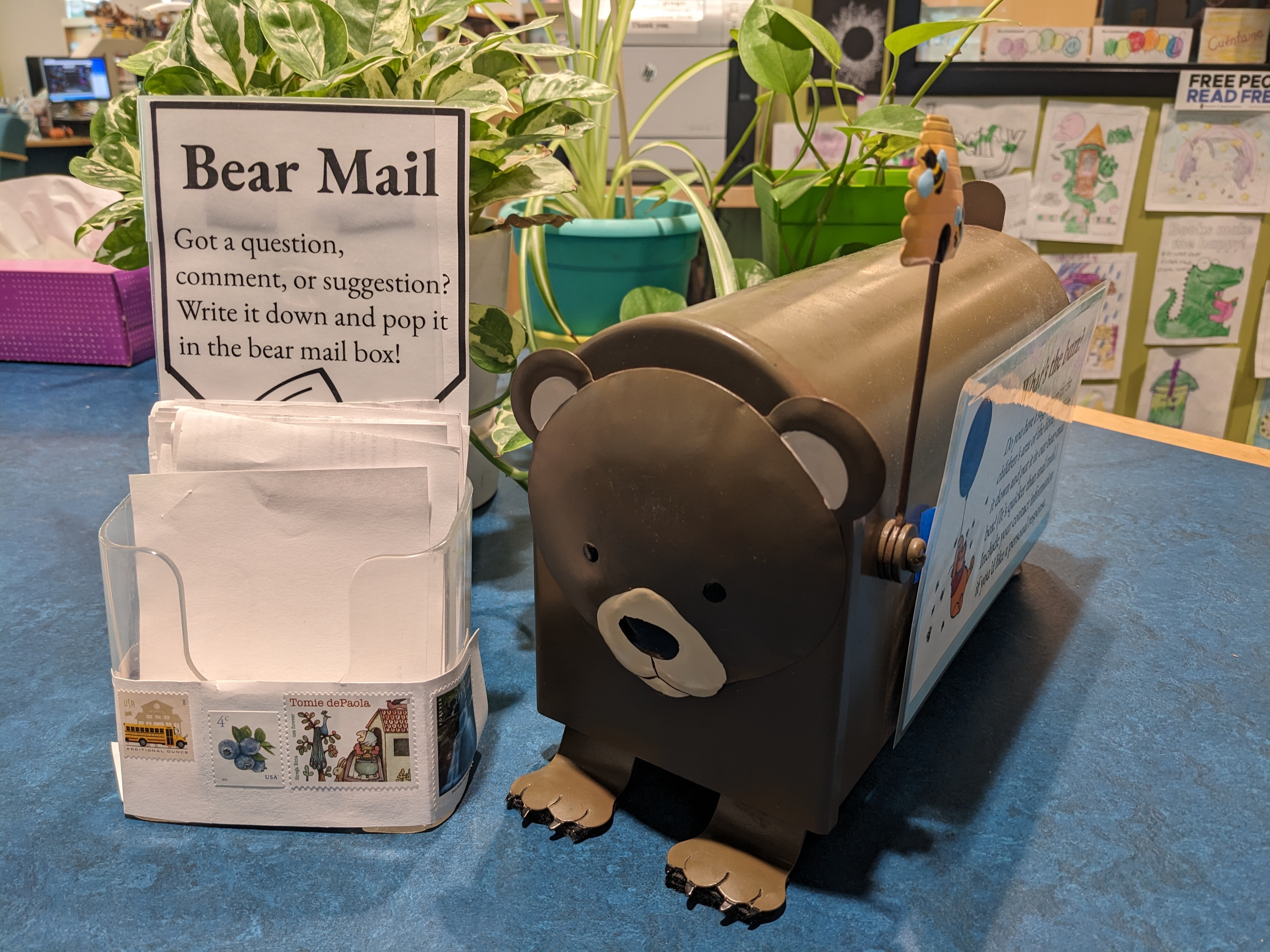 Bear-shaped desk mailbox with beehive flag and scrap paper for writing notes
