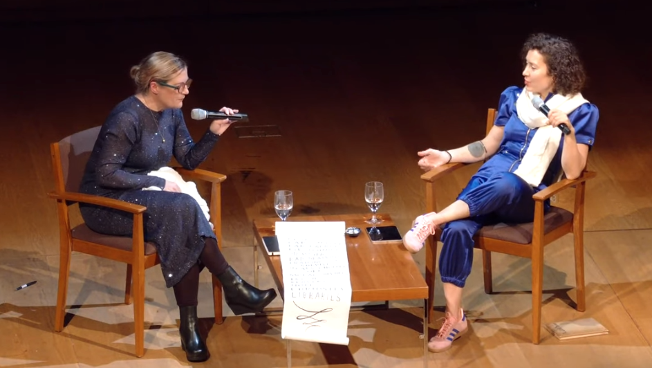 Sophie and Maria with a paper list on the table between them