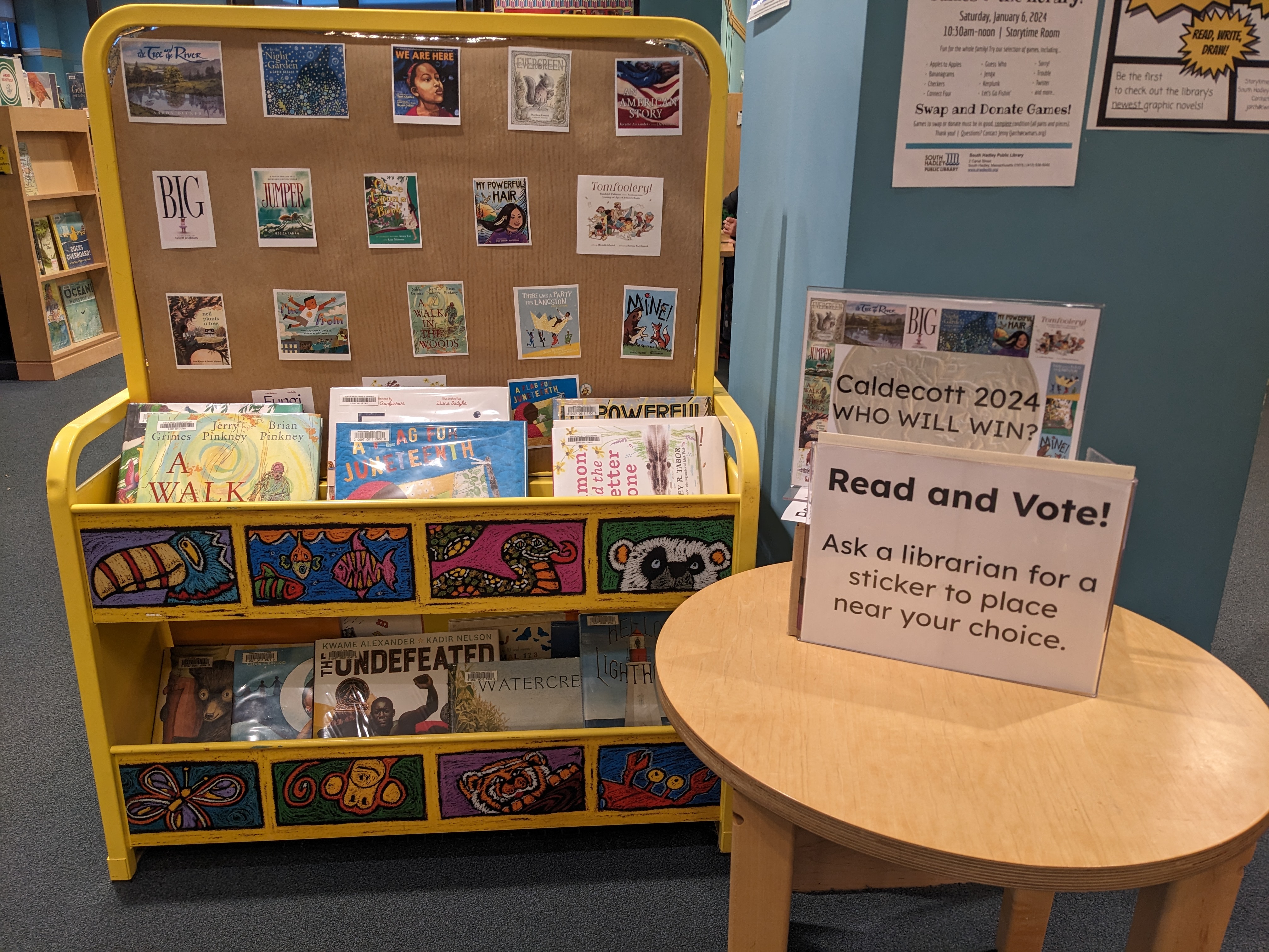 Display of Caldecott contenders and stickers to vote